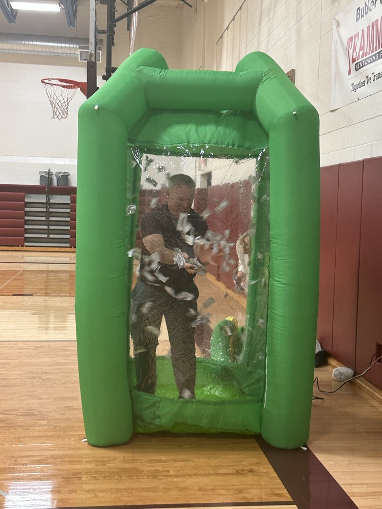 Principal Biltolf in the Money Machine at the student assembly.